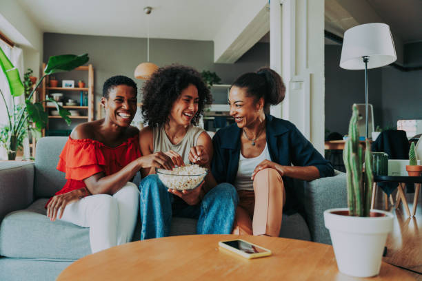 istock Three mixed race hispanic and black women bonding at home 1440935162