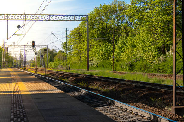 istock Railway station. The way forward railway for train. Empty Railway track for locomotive. Transportation system Nature background around. travel 1440935234