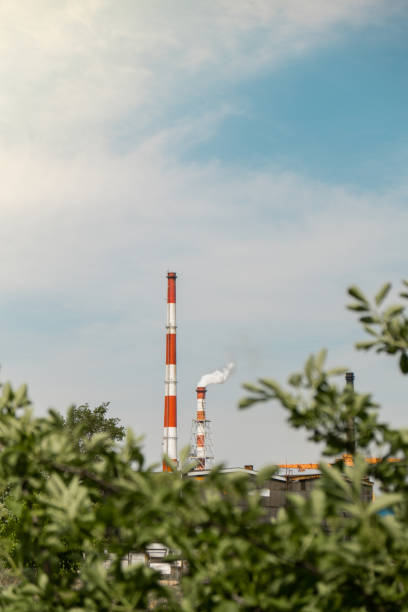 istock Factory pipe polluting air time lapse, environmental problems. Industrial factory pollution, smokestack exhaust gases. Global warming Toxic enterprise chimneys tubing Industry zone, thick smoke. Climate change, ecology, atmosphere gas, ozone layer 1440935292