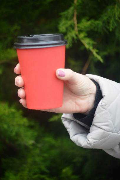 istock girl with a glass in her hands 1440935312