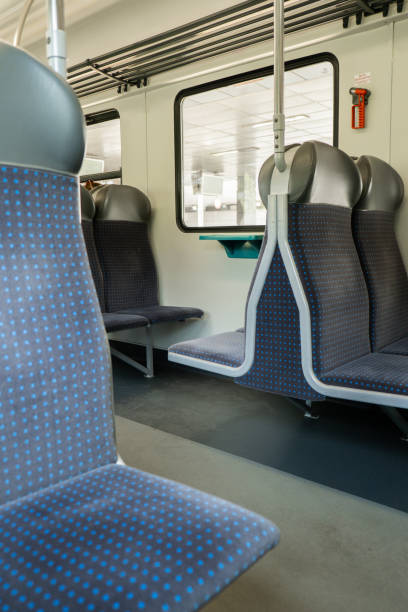 istock View on railroad track from the window of fast train. Interior view at train's empty window seat window move through countryside Window side view during commute and travel by Train 1440935318