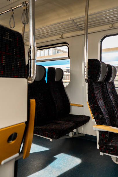 istock View on railroad track from the window of fast train. Interior view at train's empty window seat window move through countryside Window side view during commute and travel by Train 1440935355