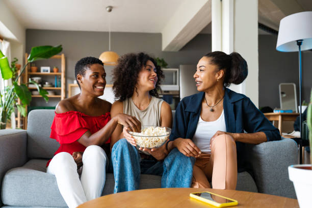 istock Three mixed race hispanic and black women bonding at home 1440935516
