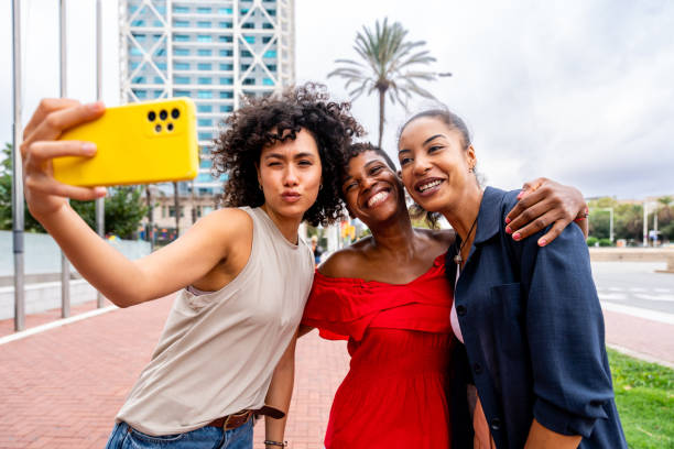istock Three mixed race hispanic and black women bonding outdoors 1440935616