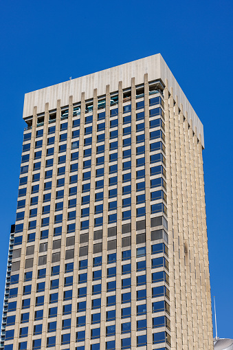 Top of a building with deep blue sky.