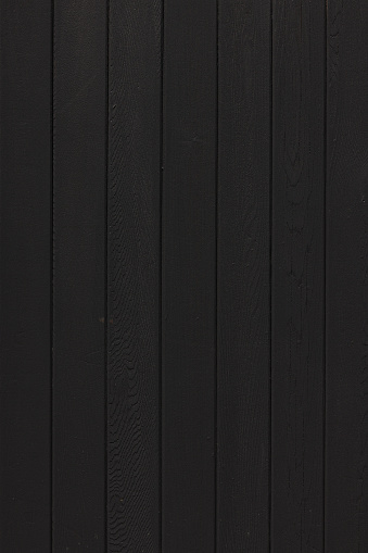 Black wooden fence detail.
