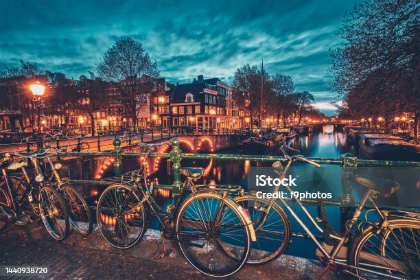Amterdam Canal Bridge And Medieval Houses In The Evening Stock Photo - Download Image Now
