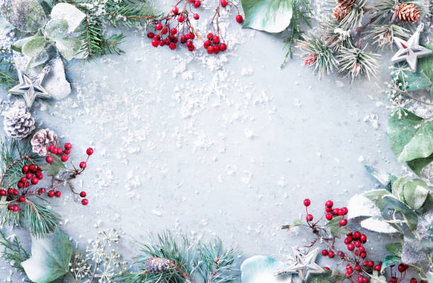istock Flat lay composition with winter fir branches, pine cones, evergreen plants and berries on snowy background 1440938791