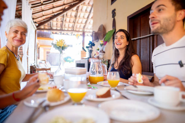 istock Smiling friends talking over lunch together on a patio 1440943347