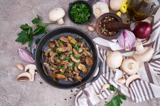 istock black ceramic bowl with fried mushrooms on grey concrete background 1440945176
