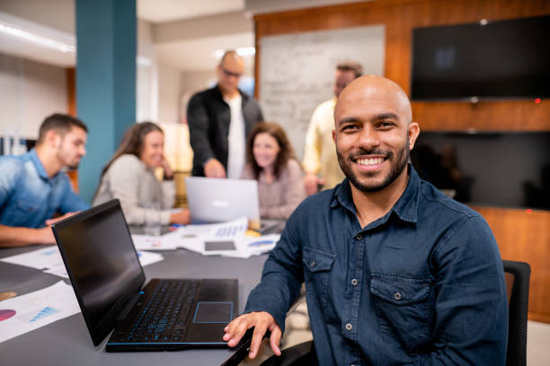 istock African man smiling during a meeting with colleagues in boardroom 1440946794