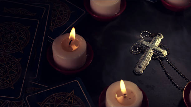 istock Christian Religion Symbol Cross in Candle Light 1440947074