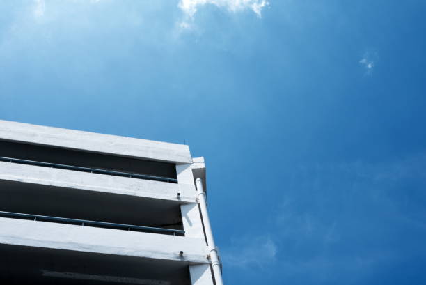 istock Car Parking Building with Blue Sky in Minal Style. 1440947451