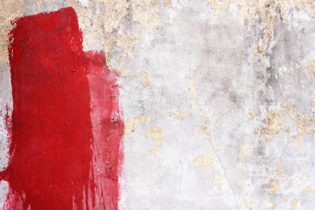 istock Stained Red Painting on Grunge Concrete Wall Texture Background. 1440947457