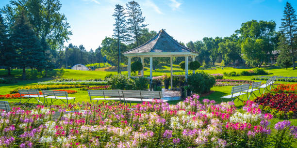 istock Beautiful pavilion garden with vibrant spring flowers 1440947627