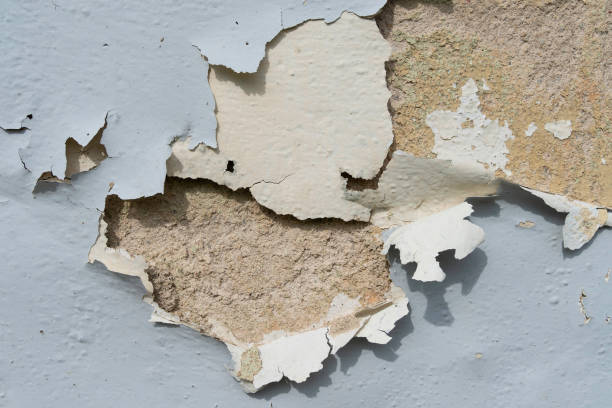 istock Close-up view of the wall paint peeling off. 1440949671
