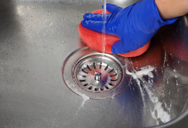 istock Cleaning the kitchen sink with baking soda 1440949748