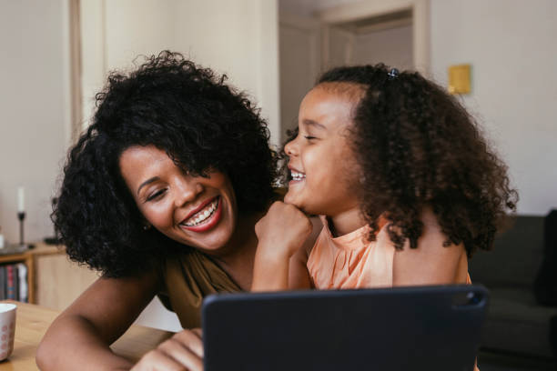 istock Mother And Daughter Using A Laptop At Home 1440949843
