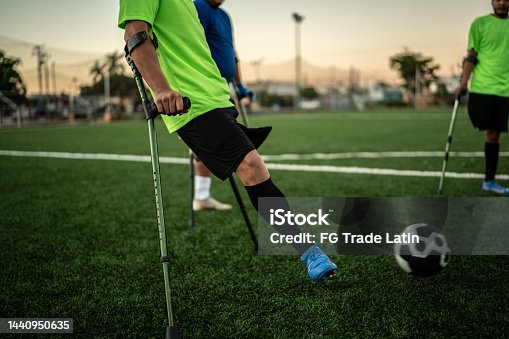 istock Amputee soccer players playing with the ball on the soccer field 1440950635