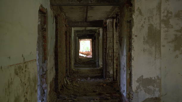 istock Passage along the corridor of an old abandoned building. 1440951144