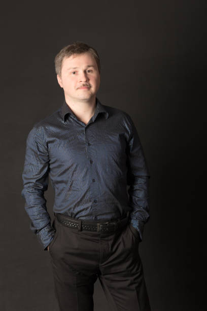 istock studio portrait of a man on a black background 1440953254