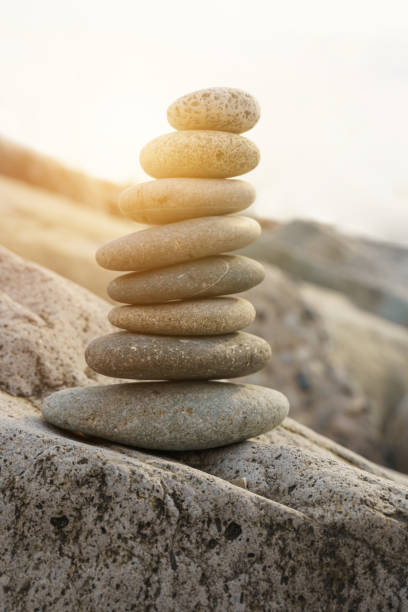 istock Pyramid stones balance on the beach in the sun. 1440959939