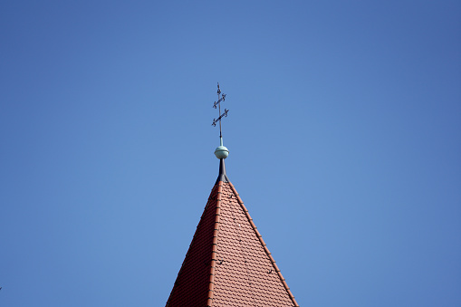 A closeup shot of the roof of a building in Orseg National park on a blue sky background, Hungary