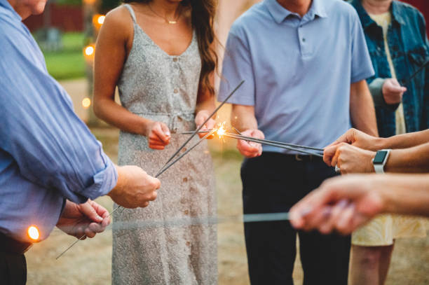 istock People holding fire-sticks together and burning bengal fires 1440968567