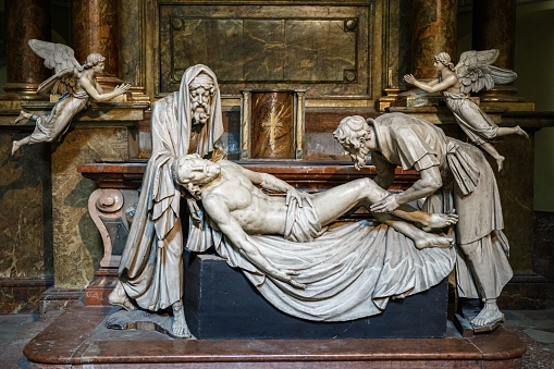 A beautiful statue of the burial of Jesus with Nicodemus and Joseph in Michaelerkirche, Vienna
