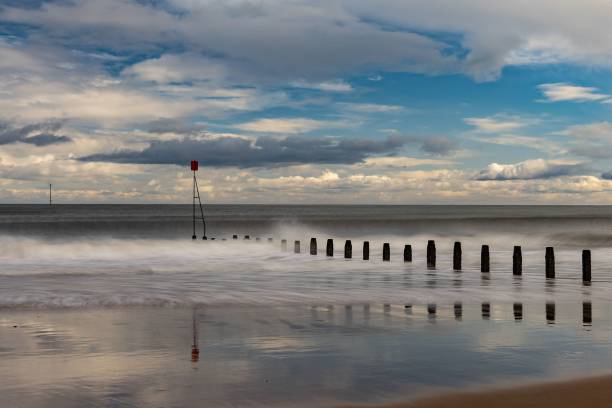 istock South beach Blyth, wooden groins on a cloudy day 1440968955
