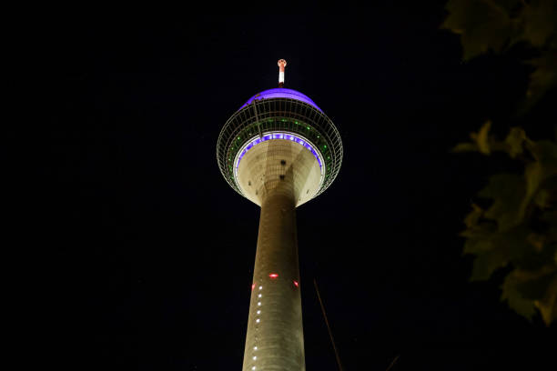 istock Low angle night shot of Rheinturm Tower in Dusseldorf, Germany 1440969190