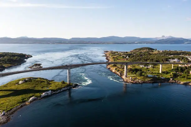 Aerial drone view of the Salstraumen bridge and the worlds strongest maelstrom, tidal current, in Bodo, Norway