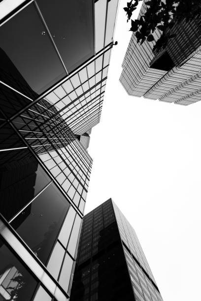 istock Grayscale low angle shot of office buildings in downtown Toronto emphasizing architectural grandeur 1440969738