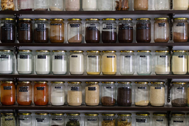 istock Jars filled with different spices on shelves 1440970071