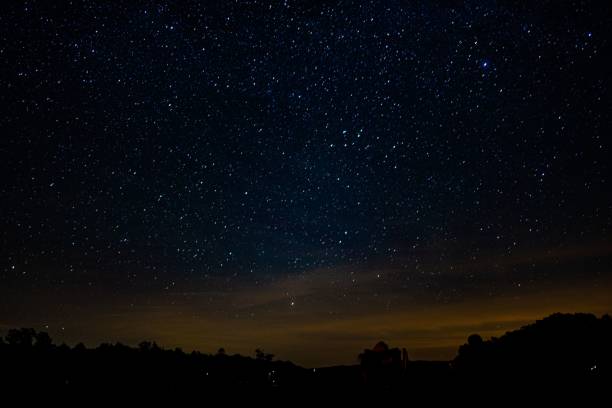 istock Stunning starry sky with light of dusk 1440970186