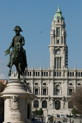 Porto, Portugal – April 13, 2009: The King Dom Pedro IV statue on a sunny day with Porto City hall in the background in Porto