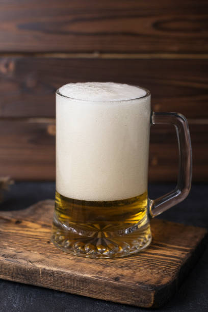 istock fresh cold beer in a glass on wooden table 1440972190