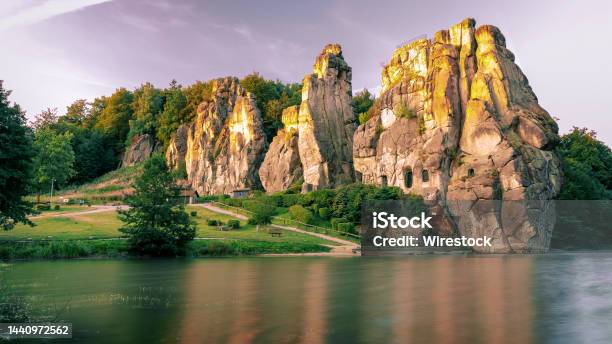 Externsteine Rocks On The Shore Of Wiembecke In The Teutoburg Forest In Detmold Germany Stock Photo - Download Image Now