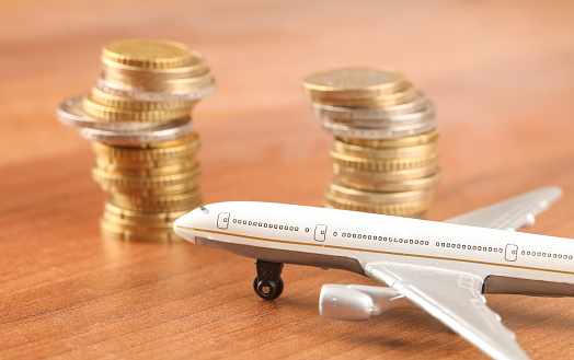 A plane with money- concept the airlines business