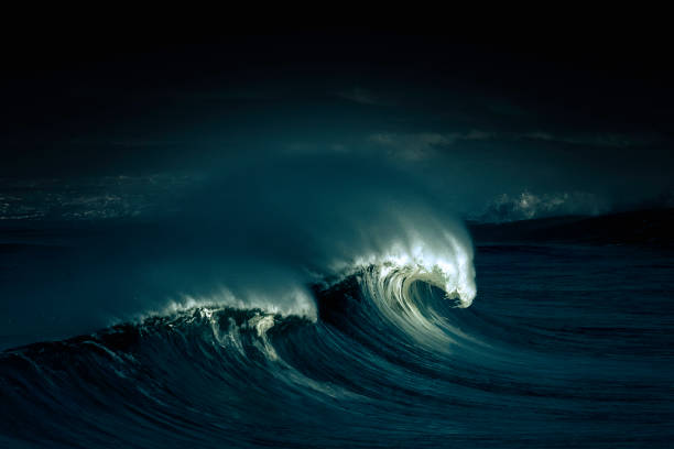 istock Beautiful shot of a wave at night 1440974405