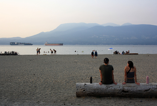 Vancouver, Canada – August 08, 2021: A view of people resting on Kitsilano Beach, Vancouver, Canada