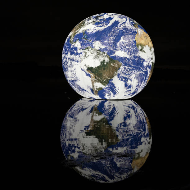 istock Beautiful view of an earth reflected in water 1440974773