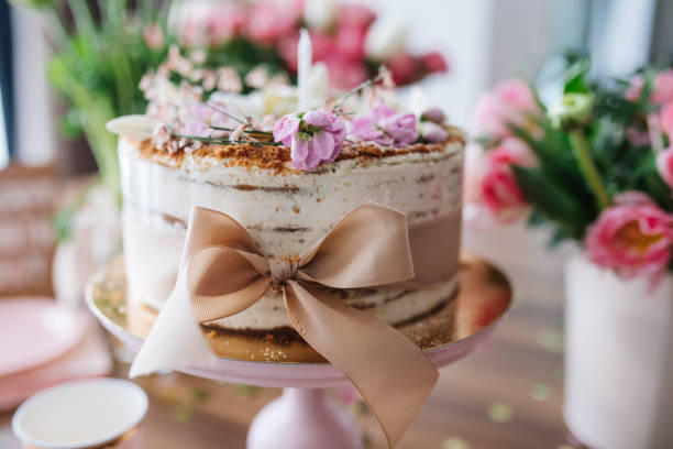 istock Closeup of a wedding cake with a ribbon 1440974844