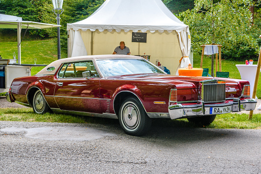 Baden-Baden, Germany - 14 July 2019: red maroon Lincoln Continental Mark IV 4 full-size cabrio car 1972 1976