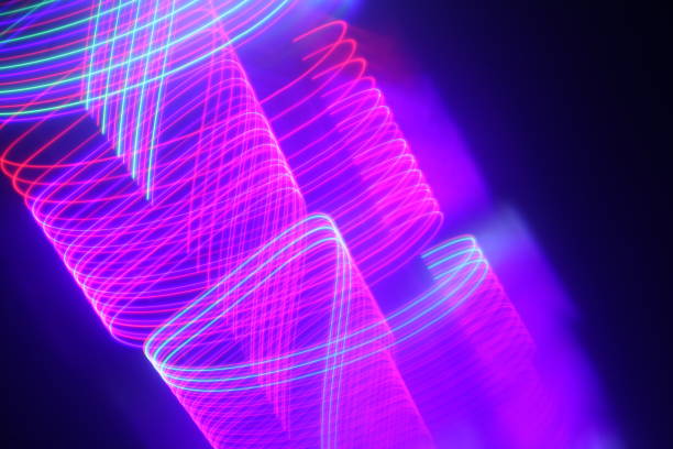 istock Abstract moving pink and blue neon lights for techno wallpaper or background 1440975365