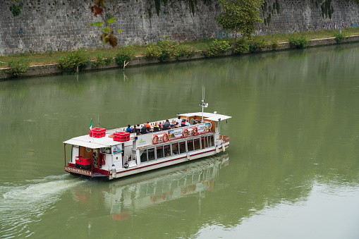 Rome, Italy – September 19, 2018: A river cruise with a ship along the Tiber in Rome one of the best ways to explore the city in Italy