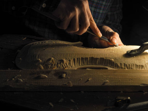 istock Closeup of a violin luthier at work 1440975862