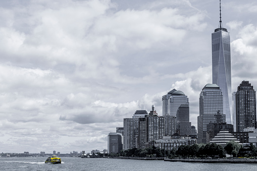 One world tower in the back Lower Manhattan urban skyscrapers seen from Hudson River