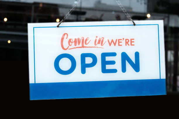 istock Open Sign in front of a Cafe and Restaurant. 1440978460