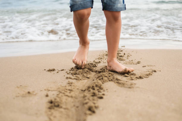 istock Child playing on a sandy beach on Crete Island 1440978675